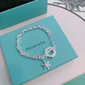 Tiffany & Co. Silver Starburst Toggle Charm Bracelet